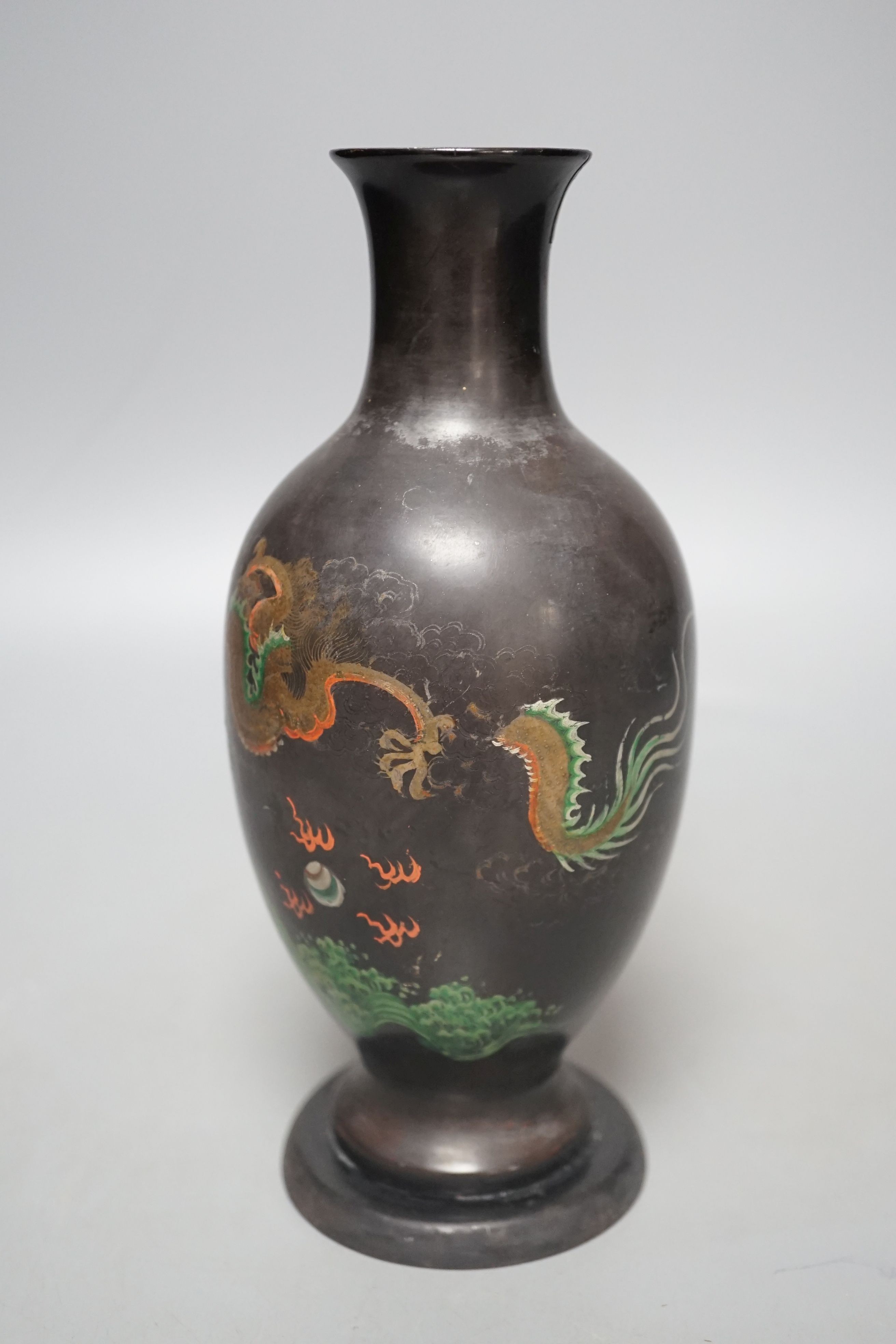 A Chinese Fuzhou lacquer papier-mâché dragon design vase, 20.5 cms high.